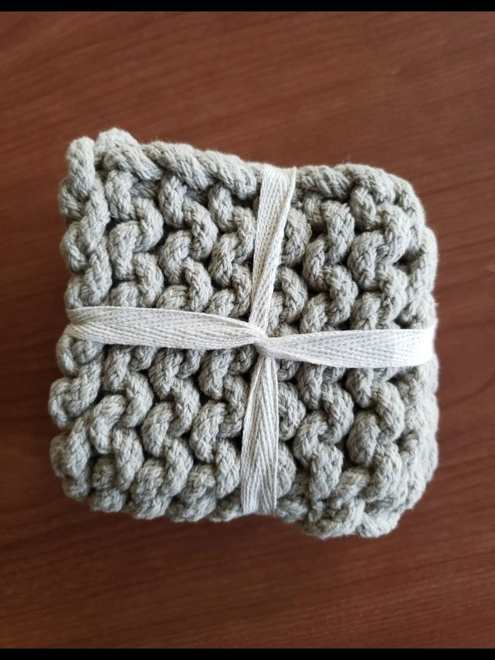 4 grey chunky crocheted coasters. NEW